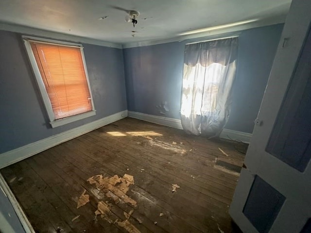 spare room with dark hardwood / wood-style floors