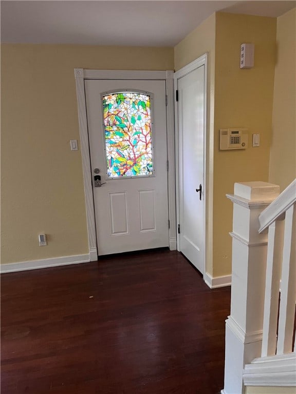 foyer with dark hardwood / wood-style floors