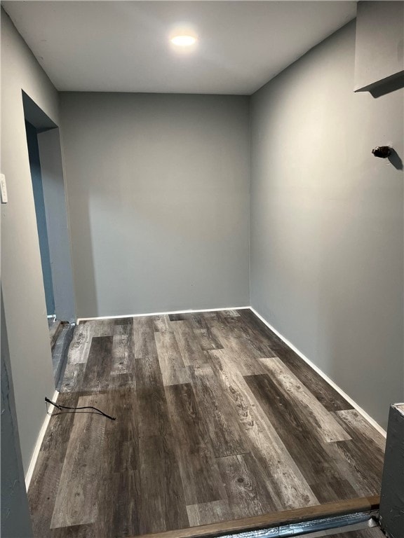 empty room with hardwood / wood-style flooring