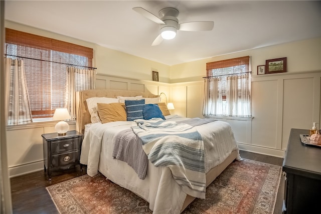 bedroom featuring ceiling fan and dark wood-type flooring