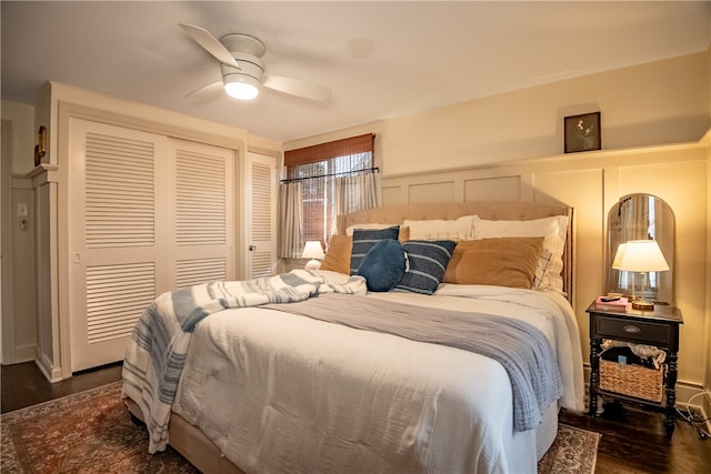 bedroom featuring ceiling fan and dark wood-type flooring