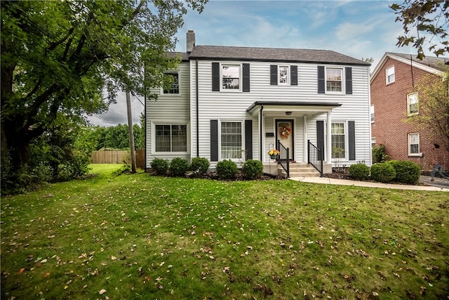 colonial home with a front yard