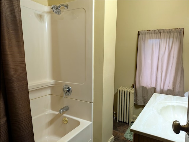 bathroom featuring radiator heating unit, shower / bath combination with curtain, and vanity