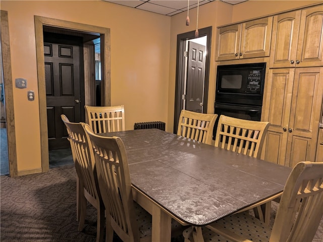 view of carpeted dining area