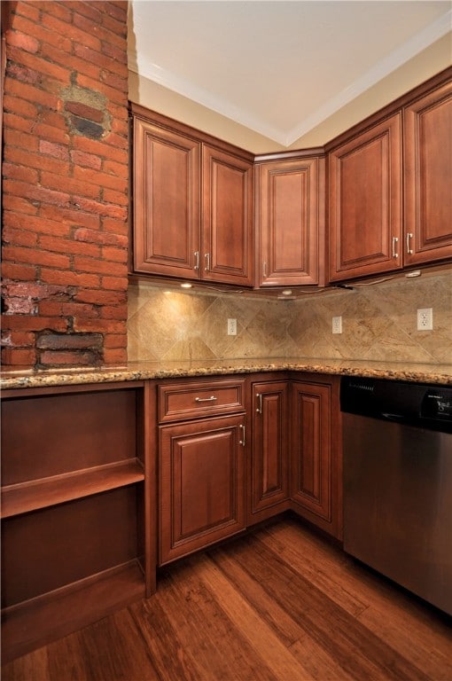 kitchen with light stone counters, backsplash, dishwasher, crown molding, and dark hardwood / wood-style floors