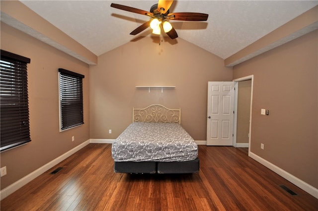 bedroom featuring lofted ceiling, dark hardwood / wood-style floors, and ceiling fan