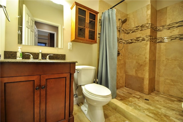 bathroom featuring vanity, hardwood / wood-style floors, toilet, and a shower with shower curtain