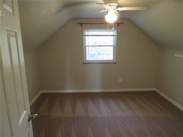 additional living space with ceiling fan, carpet, and vaulted ceiling