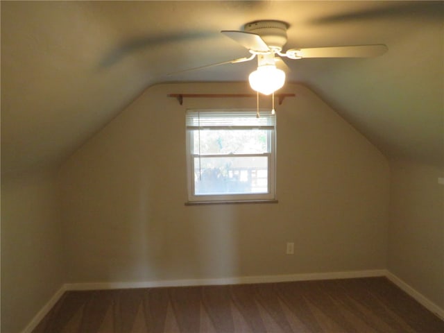 bonus room featuring dark hardwood / wood-style flooring, lofted ceiling, and ceiling fan