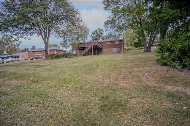 view of yard with a wooden deck