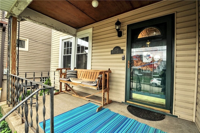 view of exterior entry featuring a porch