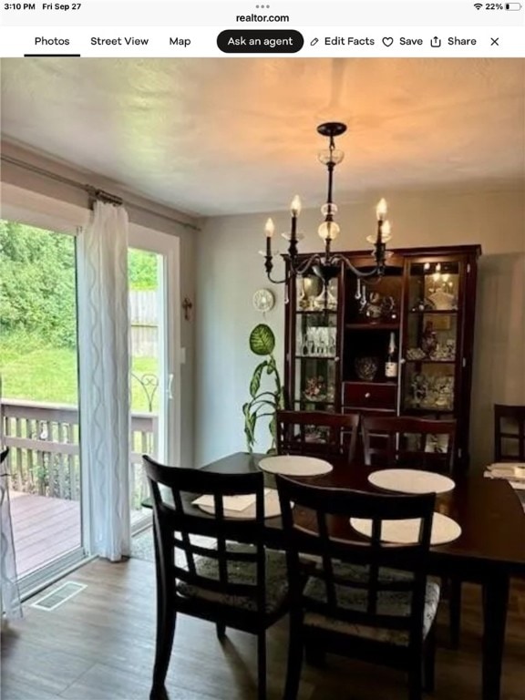 dining area featuring a notable chandelier