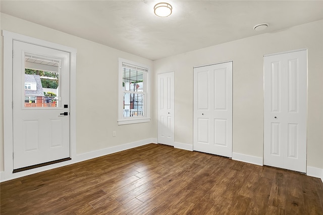 entryway with dark hardwood / wood-style floors