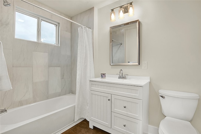 full bathroom featuring shower / tub combo with curtain, vanity, hardwood / wood-style floors, and toilet