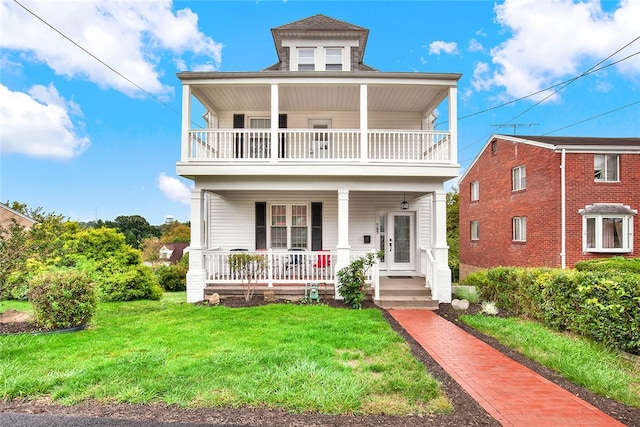 view of front of property featuring covered porch and a front yard