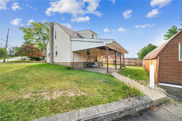 exterior space with a lawn and a patio area