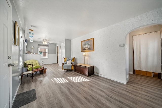 sitting room featuring ceiling fan and hardwood / wood-style flooring