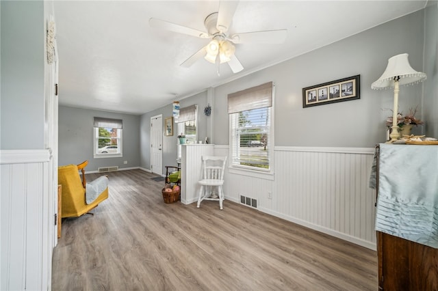 interior space with ceiling fan and hardwood / wood-style floors