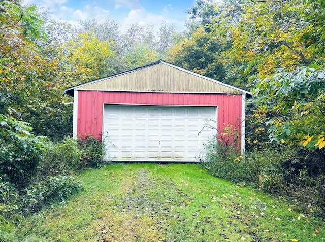 garage featuring a yard