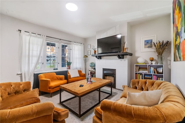 carpeted living room with a brick fireplace