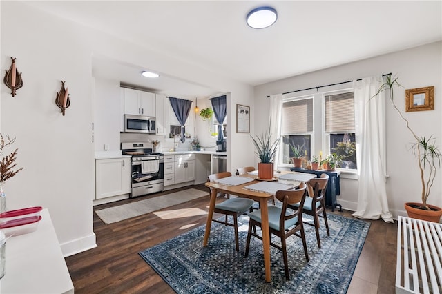 dining space featuring dark hardwood / wood-style flooring