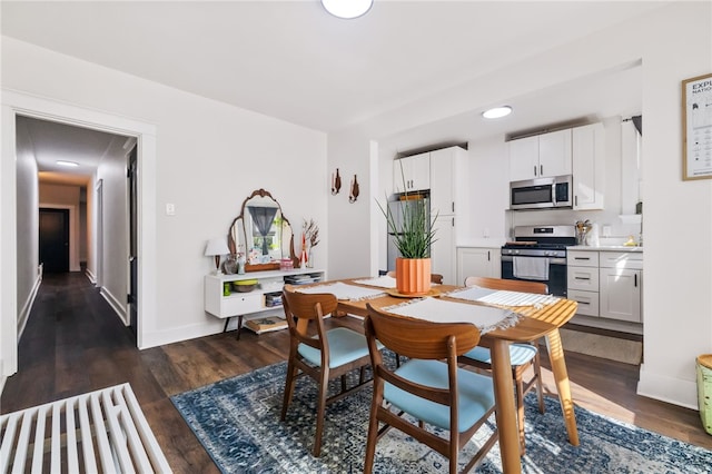 dining room with dark wood-type flooring