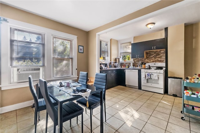 dining space with cooling unit and light tile patterned floors