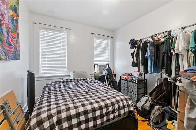 bedroom featuring cooling unit and hardwood / wood-style flooring