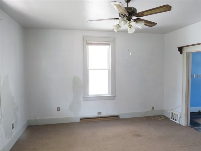 empty room featuring light carpet, ceiling fan, and plenty of natural light