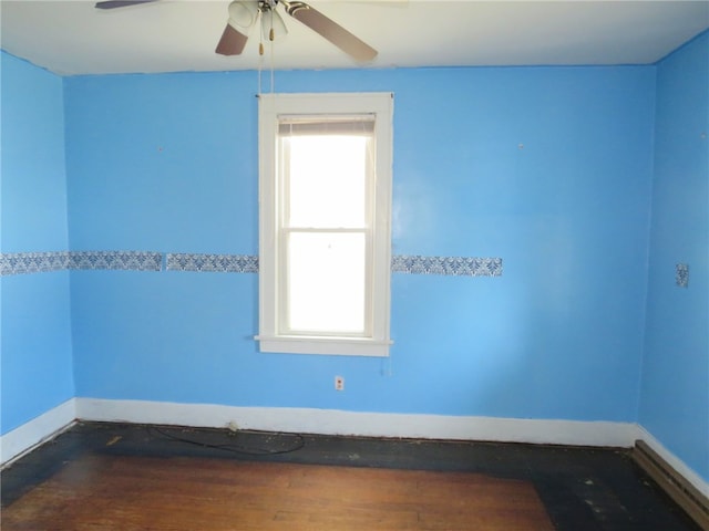 unfurnished room featuring ceiling fan and a healthy amount of sunlight