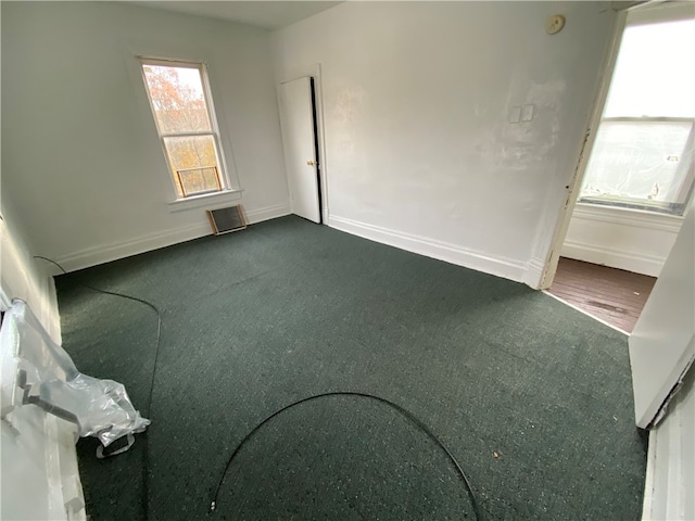 unfurnished room featuring hardwood / wood-style flooring