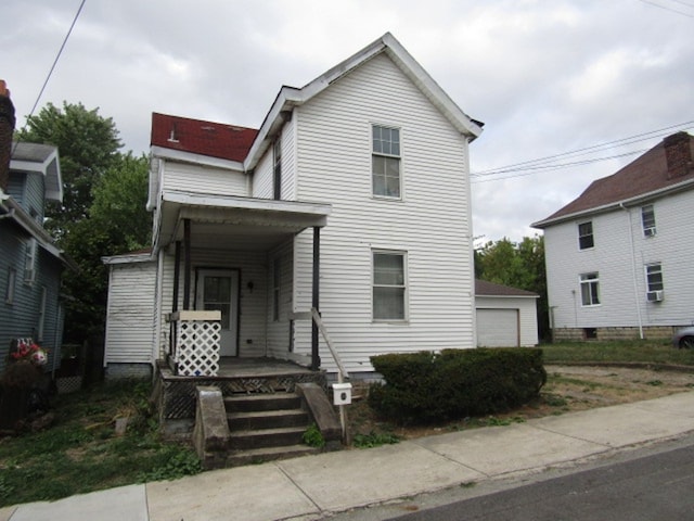 view of front of house featuring an outdoor structure and a garage