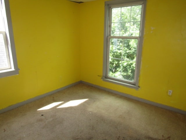 empty room featuring carpet flooring