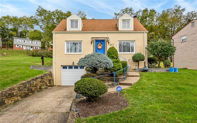 cape cod-style house featuring a front yard and a garage