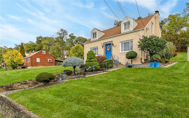 cape cod-style house with a front lawn