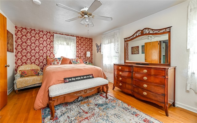 bedroom featuring ceiling fan and light hardwood / wood-style flooring