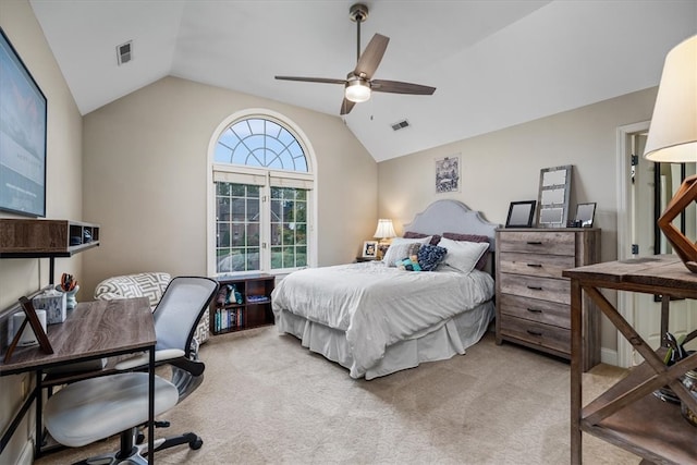 carpeted bedroom featuring ceiling fan and vaulted ceiling