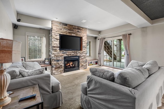 living room with a fireplace and carpet flooring