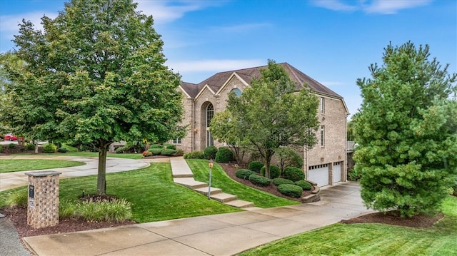 view of property hidden behind natural elements featuring a front lawn and a garage