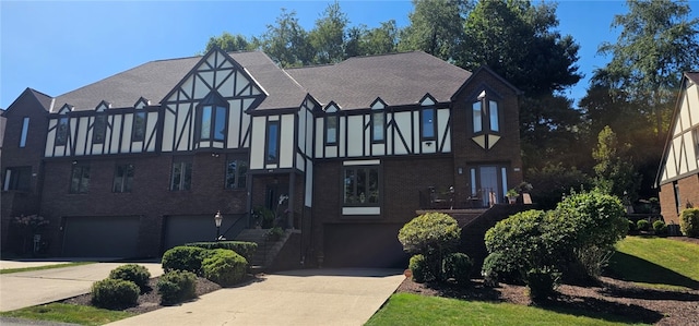 tudor house featuring a garage