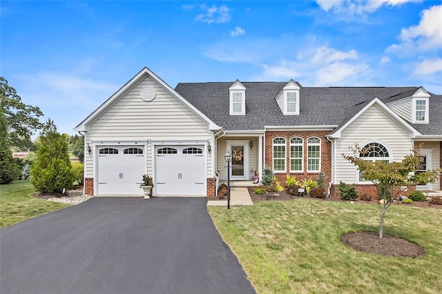 cape cod-style house with a garage and a front lawn