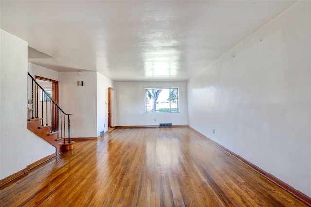 spare room with hardwood / wood-style floors