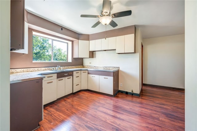 kitchen with ceiling fan, white cabinets, sink, and dark hardwood / wood-style flooring