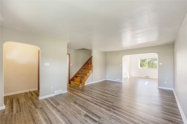 spare room with hardwood / wood-style floors