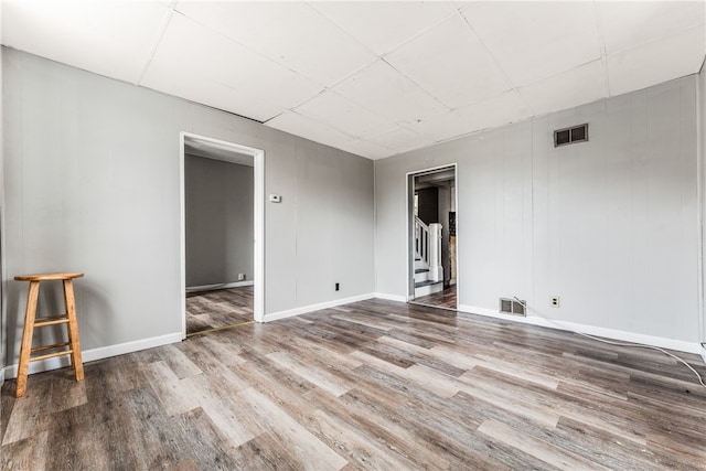 unfurnished room with wood-type flooring