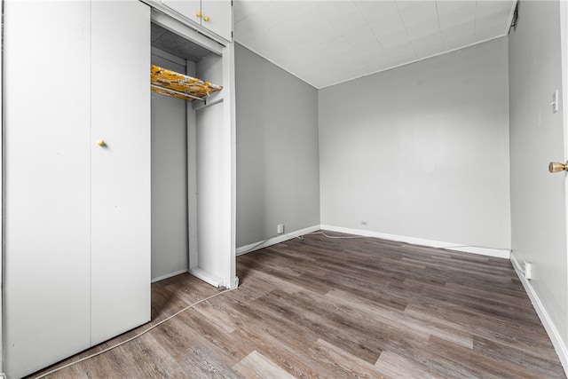 unfurnished bedroom featuring dark hardwood / wood-style floors