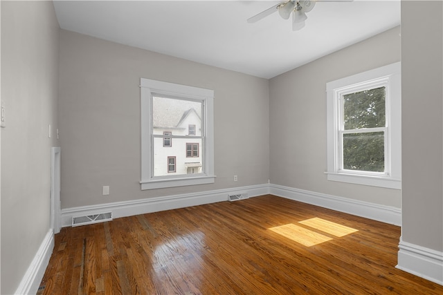 unfurnished room with hardwood / wood-style floors and ceiling fan