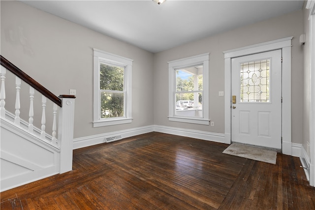 foyer entrance featuring wood-type flooring and a wealth of natural light