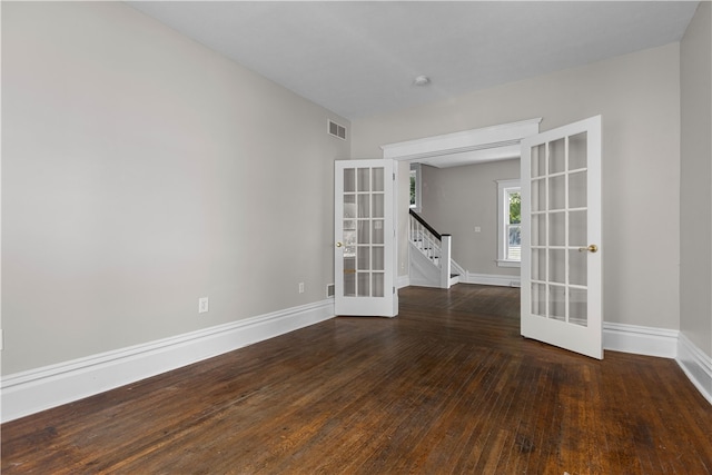 unfurnished room with french doors and dark hardwood / wood-style flooring