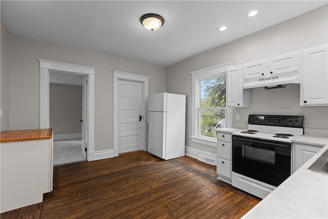 kitchen featuring white appliances, white cabinetry, and dark hardwood / wood-style floors